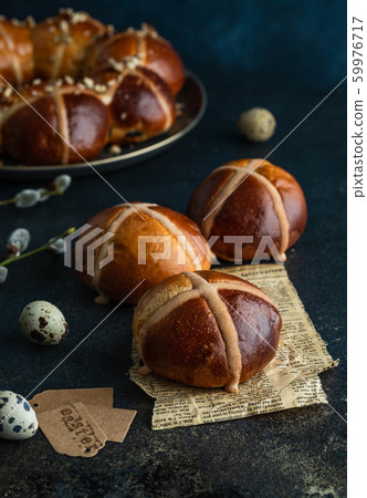 Traditional Easter cross buns on easter background. Traditional Easter cross buns on easter background. 59976717