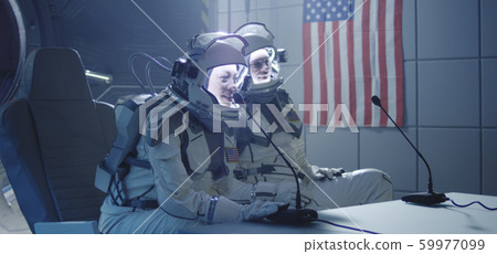 Astronauts talking at pre-flight press conference 59977099