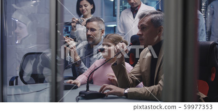 Girl talking with astronaut at press conference 59977353