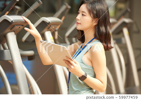 Female fitness staff Female fitness staff 59977459