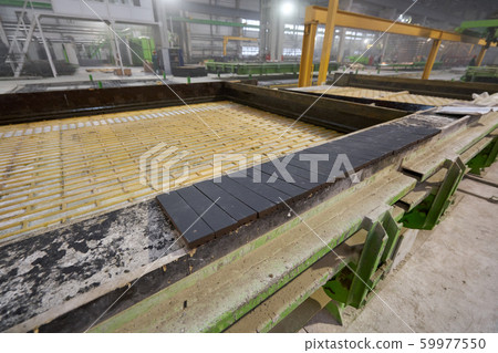Templates and formwork for cement pouring. Concrete plant. Workers in the workshop of the House 59977550