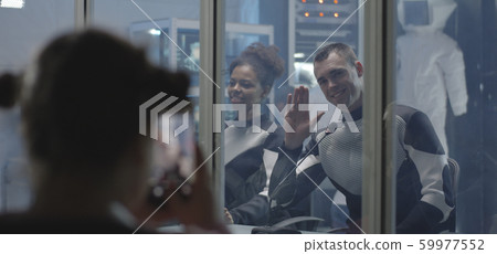 Astronauts waving in pre-flight press conference 59977552
