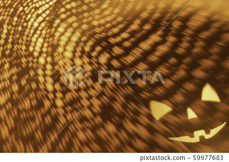 Halloween scary pumpkin face on orange paper Halloween scary pumpkin face on orange paper 59977683