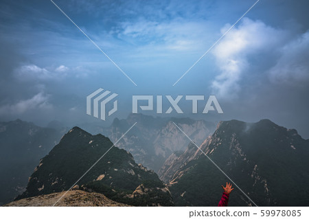 Tourist hand and mountain view Tourist hand and mountain view 59978085