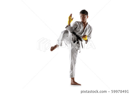 Confident korean man in kimono practicing hand-to-hand combat, martial arts 59978491