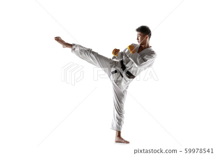 Confident korean man in kimono practicing hand-to-hand combat, martial arts 59978541