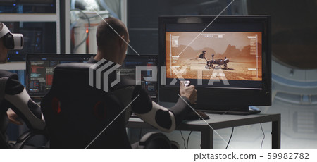 Man controlling Mars rover with remote controller 59982782