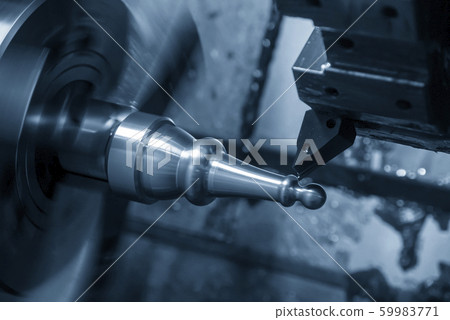 The CNC lathe machine in metal working process The CNC lathe machine in metal working process 59983771