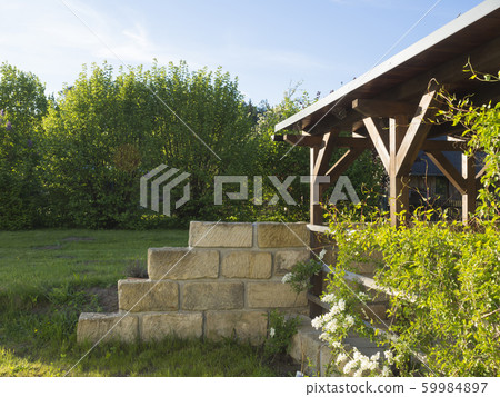 brown tiber wooden gazebo or pergola with climbing 59984897