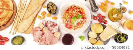 Italian food panorama. Pizza, pasta, cheese, hams, olives, wine and olive oil, shot from the top on a white background, a flat lay composition 59984981