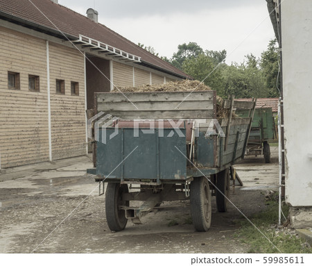 old truck with straw standing in front on barn, old truck with straw standing in front on barn, 59985611