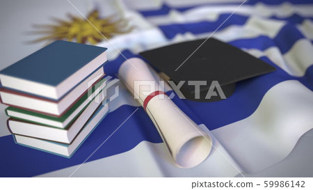 Graduation cap, books and diploma on the Uruguayan flag. Higher education in Uruguay related conceptual 3D rendering Graduation cap, books and diploma on the Uruguayan flag. Higher education in Uruguay related conceptual 3D rendering 59986142