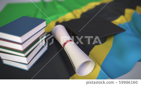 Graduation cap, books and diploma on the Tanzanian flag. Higher education in Tanzania related conceptual 3D rendering 59986160