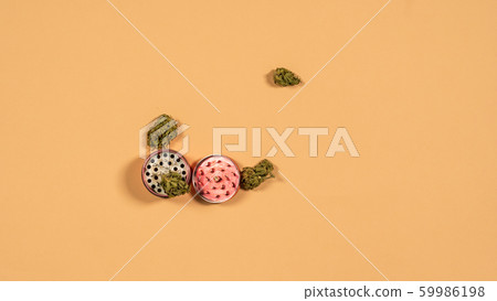 Top view of grinder with fresh marijuana buds on 59986198