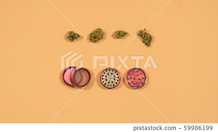 Top view of grinder with fresh marijuana buds on 59986199