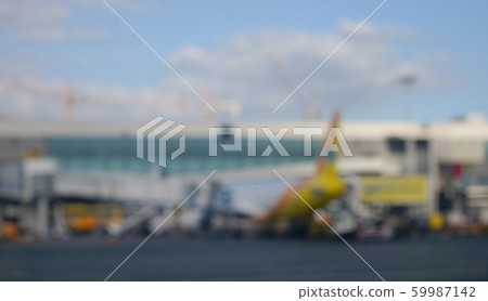 Blurred airport with airplanes on runway Blurred airport with airplanes on runway 59987142