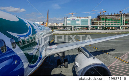 Passenger airplane docking at the airport Passenger airplane docking at the airport 59987146