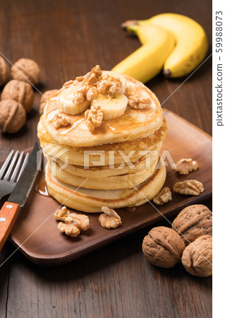 Walnut and banana pancake 59988073