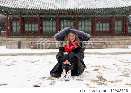 Woman looking at her eyes and having fun 59988798