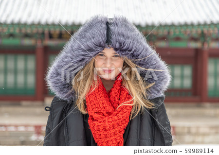 Winter photo of a beautiful blonde woman 59989114