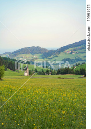 St Johann Church on the field of flowers and green 59991973