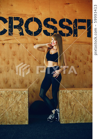Fitness girl in a gym 59993413