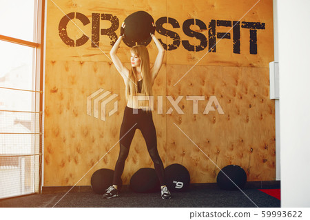 Fitness girl in a gym Fitness girl in a gym 59993622