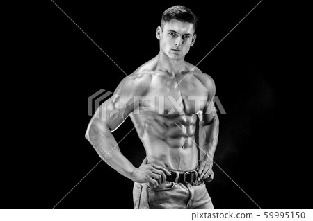 bodybuilder posing. Beautiful sporty guy male power. Fitness muscled man bodybuilder posing. Beautiful sporty guy male power. Fitness muscled man 59995150