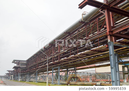 Industrial trestle for pipes. Iron pipes in the Industrial trestle for pipes. Iron pipes in the 59995839