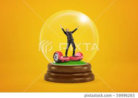 Happy businessman raising arms on red hoverboard in a snow globe on yellow background 59996263