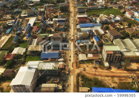 Cars traffic in Sihaoukville city streets, Drone shot Cars traffic in Sihaoukville city streets, Drone shot 59996305