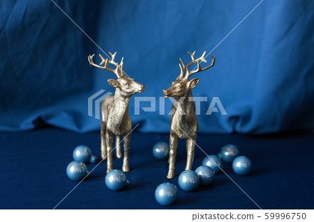 Christmas reindeers with Christmas decorations. 59996750