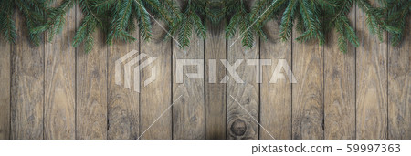Christmas holiday background. Fir branches on the Christmas holiday background. Fir branches on the 59997363