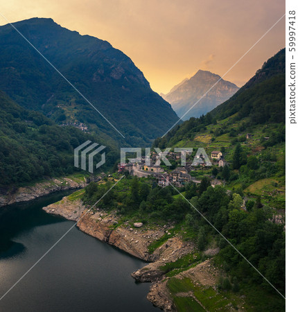 Aerial view of the village of Vogorno in the Verzasca valley in the Swiss alps Aerial view of the village of Vogorno in the Verzasca valley in the Swiss alps 59997418