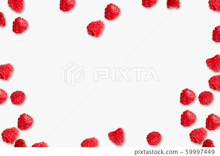 Juicy ripe red raspberry berries frame on a pink Juicy ripe red raspberry berries frame on a pink 59997449