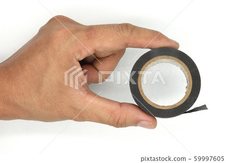 man hands holding and using an insulating tape man hands holding and using an insulating tape 59997605