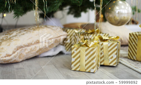 Boxes of presents under the Christmas tree Boxes of presents under the Christmas tree 59999892