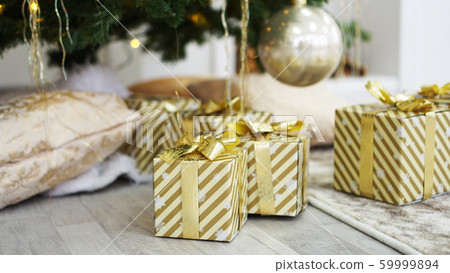 Boxes of presents under the Christmas tree Boxes of presents under the Christmas tree 59999894