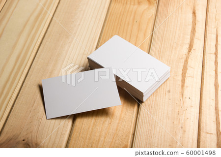 Business card blank on wooden background. Corporate Stationery, Branding Mock-up. Creative designer desk. Flat lay. Copy space for text 60001498