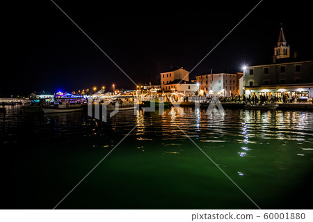 Illuminated Village Fazana In Croatia In The Night With Old Church And Boats In Harbor 60001880