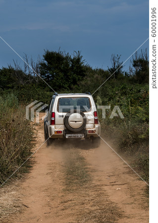 Cross Country Vehicle SUV On Dusty Gravel Road In Croatia 60001996