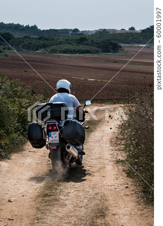 Motorbike On Dusty Gravel Road In Croatia 60001997
