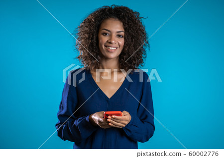 Businesswoman with smartphone. Student girl using cell phone. Beautiful woman surfing internet on mobile device. Female with modern technology device. Businesswoman with smartphone. Student girl using cell phone. Beautiful woman surfing internet on mobile device. Female with modern technology device. 60002776