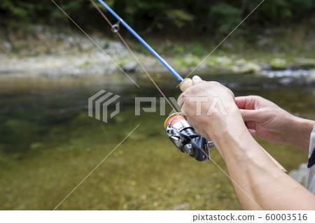Mountain stream fishing image Male hand 60003516