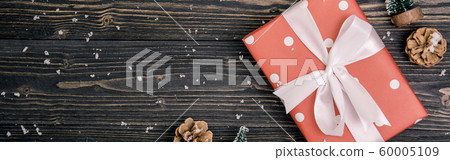 Christmas holiday composition with red gift box decoration on wooden background Christmas holiday composition with red gift box decoration on wooden background 60005109