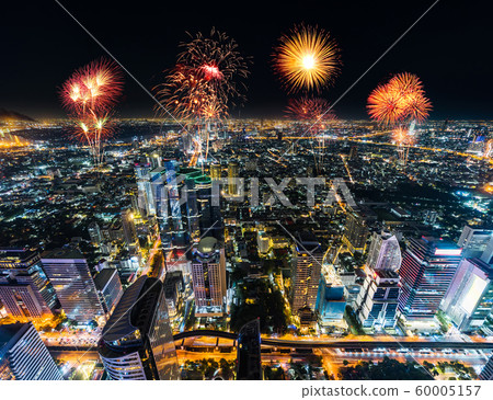 Fireworks celebrating over Bangkok cityscape at 60005157