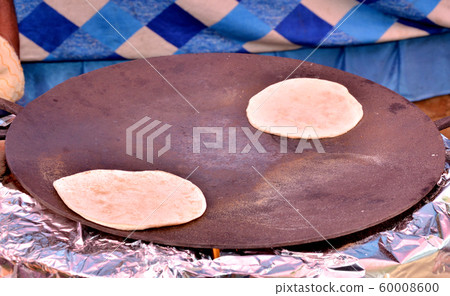 Tawa roti Indian food circular pan bread arrest Tawa roti Indian food circular pan bread arrest 60008600
