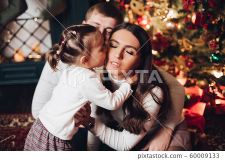 Little girl kissing her mother with love at Little girl kissing her mother with love at 60009133