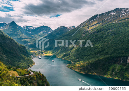 Geirangerfjord, Norway. Touristic Ship Ferry Boat Cruise Ship Liner Floating Near Geiranger In Geirangerfjorden In Sunny Summer Day. Famous Norwegian Landmark And Popular Destination 60009363