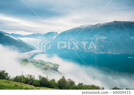 Sogn And Fjordane Fjord, Norway. Amazing Fjord Sogn Og Fjordane In Fog Clouds. Summer Scenic View Of Famous Natural Attraction Landmark And Popular Destination In Summer. Misty Weather 60009433